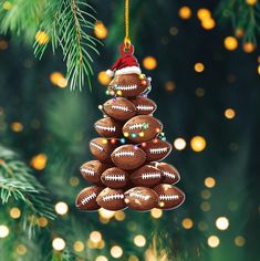 a christmas tree ornament with footballs hanging from it