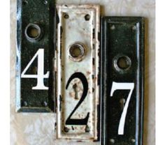 an old door with numbers on it and the number twenty four in front of them