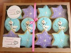 some decorated cookies in a box on a table