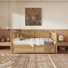 a bed sitting on top of a wooden floor next to a rug