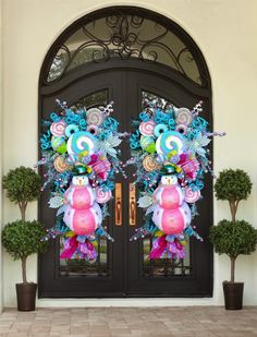 two large pink and blue decorations on the front door