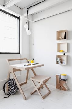 a white table and chair in a room