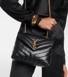 The black Loulou Small shoulder bag from Saint Laurent is a sophisticated day-to-night companion. Its buttery, quilted calfskin base is treated with a combination of paper printing, which creates a full-grain finish, and a smoothing tanning process. We don’t like to pick favorites, but this design holds a special place in our hearts – and, with its timeless looks and ever-iconic YSL hardware, we predict it will have the same effect on you..Color of fastening: antique gold.Material: calf leather. Yls Bag Saint Laurent Handbags, Ysl Black Loulou Bag, Ysl Loulou Bag, Ysl Black Purse, All Black Ysl Bag, Ysl Sholder Bag, Timeless Looks, Ysl Bags, Saint Laurent Bags