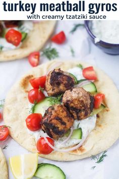 two pita breads with meatballs and vegetables on them