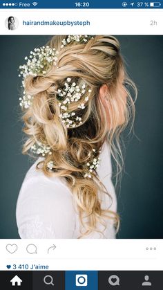 a woman with long blonde hair and flowers in her hair