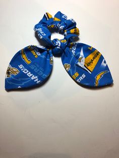 Scrunchy Scarf LA Chargers Picture is of other fabric picture of item coming soon NFL DISCLAIMER This is not a licensed LA Chargers or NFL product; it is however handcrafted from licensed LA Chargers and NFL fabric.  I am not affiliated with or sponsor by the LA Chargers or the NFL Los Angeles Chargers Logo, San Diego Chargers Football, La Chargers, Nfl Fleece Fabric, Chargers Nfl, Football Accessories, Golden Knights, Fabric Pictures, Henderson Nv