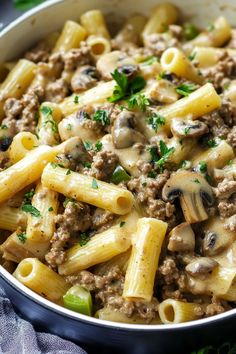 pasta with ground beef and mushrooms in a skillet