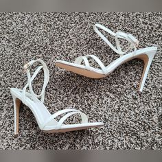 Lulus Lianya Style White Stiletto Heels Vegan Leather Ankle Strap Buckle Closure Heel Height 4 Inches Imperfections: Yellow Glue On The Edges Of Insoles; Not Visible When Worn Comes With Original Box Formal Heels With Straps And Open Heel, Formal Open Heel Strapped Heels, Formal Strappy Open Heel Heels, White Strappy Heels With 4-inch Heel, White Strappy Sandals For Party, Strappy Heels With Padded Heel For Wedding, White Party Sandals With Straps, Formal Strappy Heels With Padded Heel, Wedding Heels With Wrapped Heel And Strappy Design