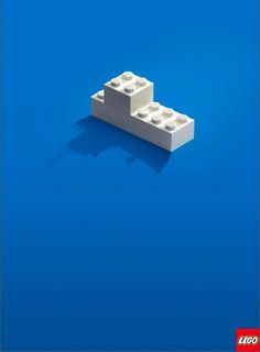 two white lego blocks on a blue background