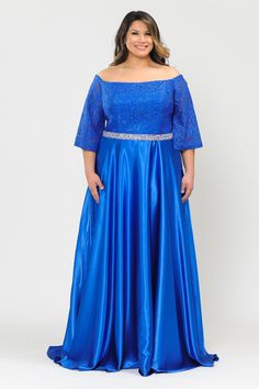 Look modest chic in this plus size long off the shoulder dress with lace bell sleeves by Poly USA W1008. This beautiful gown features a straight across lace bodice, illusion bell sleeves, removable bead embellished waistband, convenient side pockets, open back, floor length A-line crepe satin skirt with sweep train, and a lace-up corset back. Designer: Lindas Plus by Poly USA Style Number: W1008 Off The Shoulder Gown with Long Bell Sleeve Stretchy Lace Top Crepe Satin Long Dress with Pockets and Detachable Rhinestone Belt Floor length A-line skirt Fit: The model is 5'7" and is wearing 14W Colors: Red, Black, Royal Blue Sizes: 14W to 24W Occasions: Prom, Red Carpet, Gala, Wedding Gown, Debutante Ball, Military and Marine Ball, Evening Wear, Formal, Mother of the Bride/Groom This item ships