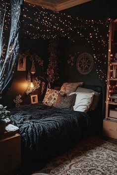 a bedroom with lights on the ceiling and a bed in front of a book shelf