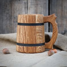 a wooden mug sitting on top of a table