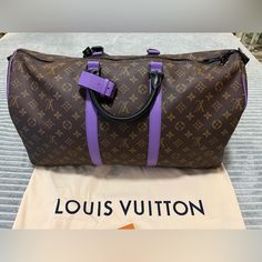 Beautiful Pop Of Bright Purple Accents Elevate This Classic Lv Keepall With An Upgraded Bandolier And Black Hardware In Mint Condition. Lv Keepall, Louis Vuitton Keepall 50, Purple Accents, Louis Vuitton Keepall, Bright Purple, Black Hardware, Duffel Bag, Mint Condition, New Color