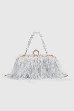 Elevate your style with our Pearl Fringe Feather Handbag. This luxurious accessory seamlessly blends the classic charm of pearls, the playful elegance of fringe detailing, and the exotic allure of feathers. The handbag is a true embodiment of sophistication, perfect for making a statement at upscale events and adding a touch of glamour to your ensemble. Carry it with confidence and let your unique sense of style shine. Fluffy Tote Bag, Pearl Fringe, Fringe Clutch, Classic Crossbody Bag, Fringe Necklace, Beauty Bag, Shoulder Purse, Mini Fashion, Black Handbags