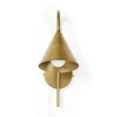 a wall mounted light with a cone shaped shade on it's face and arm