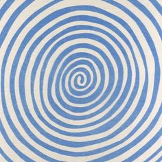 a blue and white rug with circles on it