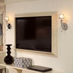 an image of a tv on the wall in a living room with pictures and lights