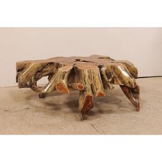 a coffee table made out of tree trunks