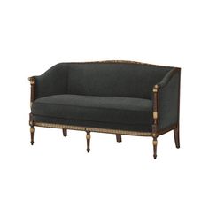 an old fashioned couch with gold trimmings and dark gray upholstered fabric