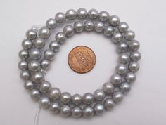 Material : Genuine Freshwater Pearls Color : Silver Gray as pictured Bead Shape : Potato / Off Round shape as pictured Bead Size : 8-9mm approx. Hole Size : 2.2mm approx. Quantity : Half Strand - 7.5 inch. 26-27 pcs per strand approx. ; OR Full Strand - 15.5 inch, 52-54 pcs per strand approx. Lead Time & Shipping : We ship your order within 24 hrs. (Monday-Friday). If we offer FREE DOMESTIC shipping, package will be shipped via USPS First Class mail on orders shipping within the U.S.. **Expr Gray Round Spacer Beads Jewelry, Gold Star Pendant, Round Rings, Seed Pearl, Freshwater Cultured Pearls, Pearl Color, Star Pendant, Gold Stars, Pendant Set