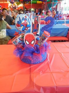 a spiderman centerpiece on top of a table at a children's birthday party