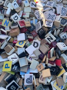 a pile of wooden blocks with letters and numbers on them