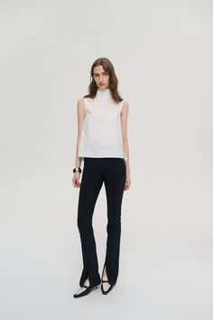 Elegant Sleeveless Tie-back Blouse, Elegant Sleeveless Tie Back Blouse, Chic Stretch Tank Top With Tie Back, Elegant Tank Top With Tie Back, Chic Sleeveless Tank Top With Tie Back, Chic Stretch High Neck Blouse, Chic Sleeveless Stretch Tops, Chic Stretch Sleeveless Tops, Elegant Stretch Halter Sleeveless Blouse