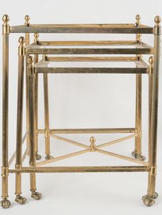 three tiered brass and glass side tables