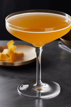 Discover the lively Buzz Bomb cocktail recipe featuring vodka, cognac, and effervescent champagne. This visual showcases a beautifully garnished drink ready for a classy gathering. Fun Cocktail Recipes, Bobby Burns, Bomb Drinks, Mandarin Juice, Goodnight Kiss, Singapore Sling, Orange Liqueur