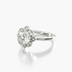 a diamond ring with an oval shaped center