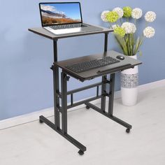 a computer desk with a laptop on it