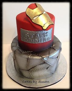 the cake is made to look like iron man's helmet and armor on top