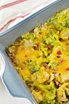 a casserole dish filled with broccoli and cheese