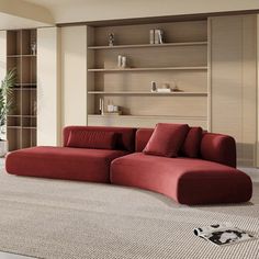 a living room with a large red couch