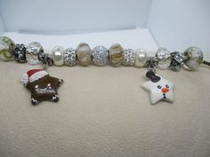 #3165 Handmade, Large Beaded Silver Plated Christmas Bracelet wiith Clay Snowman & Gingerbread Man .. 7 1/2-7 3/4"... $26 ..This item and items for the entire family can be found at my website www.charmedbycharmsbycindy.com Stop over and visit and see all my amazing items that I have for sale.. Thanks !!! Clay Snowman, Ideas Navidad, Christmas Bracelet, Gingerbread Man, Clay Crafts, Pandora Charm Bracelet, Gingerbread, Silver Plate