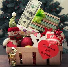 a christmas gift box filled with money and toys