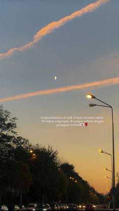 an image of the sky and street lights at dusk with a quote written on it