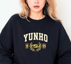 Dive into the world of Ateez with this exclusive Yunho Sweatshirt. These stylish and comfortable sweatshirts pay homage to the incredible talent and charisma of each Ateez member. Choose your bias or collect them all to showcase your love for this sensational K-Pop group. Crafted from premium, cozy fabric, these sweatshirts are more than just clothing; they're wearable tributes to the distinctive personalities that make up the powerhouse that is Ateez. Whether you're a seasoned ATINY or a new fan discovering the group's magic, these sweatshirts let you wear your Ateez pride with style. From Hongjoong to Seonghwa, Yunho, Yeosang, San, Mingi, Wooyoung, and Jongho, each sweatshirt features the name of a beloved member, allowing you to represent your bias or create a fan wardrobe that's as div Ateez Merch, Yunho Yeosang, Ateez Yunho, Cozy Fabric, Sweater Gift, Pop Group, K Pop, Sweat Shirt, Jumper