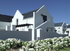 a house with white flowers in front of it