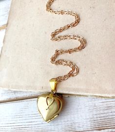 This is a romantic heart folding locket necklace. This vintage style golden brass locket folds out to reveal space for four different photos. (Photo insertion not included.) You can personalize the locket by printing your own photos and inserting them inside the locket. The locket measures 30mm long by 22mm wide and hangs from a gold plate chain. This lovely locket necklace makes a wonderful gift for mom! You can personalize your necklace with initial charms - https://www.etsy.com/listing/264281 Clover Locket, Gold Heart Locket Necklace, Gold Heart Locket, Romantic Heart, Heart Locket Necklace, Cotton Drawstring Bags, Photo Locket, Photo Heart, Fall Jewelry