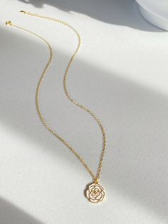 Adorn yourself with the beauty of nature with our Camellia pendant necklace! This necklace features a stunning camellia flower that represents love, admiration and gratitude. The elegant design is completed with sterling silver plated with gold cable chain, making it perfect for everyday wear or special occasions.  It's so beautiful either have it alone or layered with other necklace, have it with dress or sweater. Pendant size is 1.2cm Necklace length is 40+5.5cm As it's a handmade item please allow 2-3mm difference. Please keep them away from chemicals such as perfume, hairspray ect. Better remove before shower and swim.   The product is made by care and love 💕 Delicate Rose Flower Shaped Jewelry, Elegant Rose-colored Floral Jewelry, Dainty Rose-colored Flower-shaped Jewelry, Elegant Rose-colored Jewelry As A Gift For Her, Delicate Rose Flower Jewelry, Rose Gold Flower-shaped Necklace As Gift For Her, Elegant Rose Gold Necklace As Gift For Mom, Elegant Rose Gold Necklace For Mom, Feminine Flower Pendant Necklace With Clavicle Chain