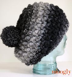 a crocheted hat is shown on top of a mannequin head