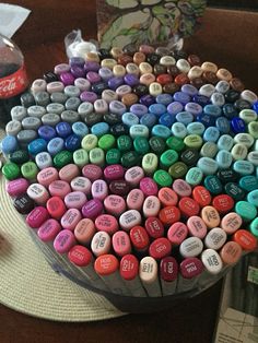 there is a cake made out of many different colored hearts on top of the table