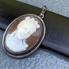 We take pride in finding unique , quality ~ Antique /Vintage jewelry pieces which are carefully hand picked by us so that you can add them to your treasure/ collection or gift to someone you love ~ We try to add plenty of items every week and have been selling online for more then 10 years . Antique Victorian ~ sterling silver ~ deeply hand carved cameo ~ pendant ~ Just add chain and its ready to wear . Marked 800 for silver Dates late 19th to early 20th century Materials : 800 silver shell came Vintage Silver Carved Jewelry, Vintage Carved Silver Jewelry, Antique Silver Cameo Jewelry, Vintage Silver Carved Necklaces, Silver Vintage Carved Necklaces, Vintage Carved Jewelry For Anniversary, Carved Vintage Jewelry For Anniversary, Vintage Stamped 925 Silver Pendant Jewelry, Antique Cameo Jewelry In Antique Silver