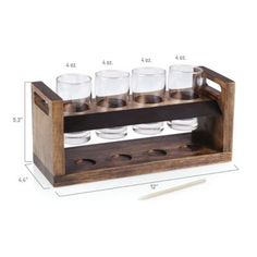 a wooden holder with six glasses on it