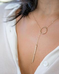 Classy, simple, delicate and beautiful Y lariat necklace features handmade hammered circle and hammered bar. It wraps around your neck and you loop the bar through the circle. No clasp.  Total length including the bar as show on the model 21 inch   Need it shorter or slightly longer? Leave me a message upon checkout.   ** This style can not be used with chain extender**  Available also in sterling silver & ROSE gold filled Adjustable Round Lariat Necklace With Delicate Chain, Elegant Round Gold Plated Lariat Necklace, Minimalist Round Lariat Necklace With Delicate Chain, Elegant Round Gold-plated Lariat Necklace, Gold-tone Minimalist Lariat Necklace With Adjustable Chain, Loop Necklace, Bridal Jewelery, Dainty Gold Jewelry, Handmade Gold Jewellery