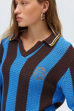 Vintage prep-inspired BDG sweater in a polo-inspired style. Designed in an oversized, slouchy fit featuring a collared v-neckline, long sleeves and an embroidered chest graphic at the chest. Find it only at Urban Outfitters. Features BDG Mitchelle embroidered crest polo sweater Collared sweater Soft & stretchy knit Collared v-neckline with contrast stripes and drop shoulder long sleeves Embroidered crest graphic at the chest Relaxed, slouchy fit Tunic length Easy pull-over style UO exclusive Con Blue Diamond Sweater, Bdg Sweater, Knitted Polo Shirt, Collared Sweater, Fitted Tunic, Knitted Polo, Blue Fits, Polo Sweater, Collar Sweater