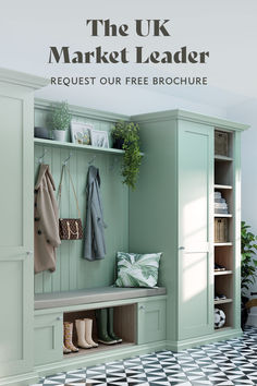 an entryway with green painted cabinets and black and white tile floor