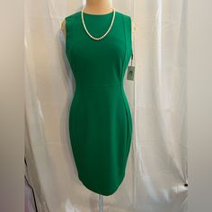 Calvin Klein Green Sheath Dress, Size 8, Nwt Pit To Pit 18 1/2” Hip 38” Total Length 39” Classic Sheath Silhouette In Vibrant Green Features A Sleek, Tailored Fit With A Gold-Tone Back Zip Closure Sleeveless, Knee-Length Design Perfect For Work Or Formal Occasions Size 8 Msrp $98, New With Tags (Nwt) Ideal For Those Seeking A Bold, Elegant Look! Green Black Dress, Green Sheath Dress, Calvin Klein Women, Sleeveless Sheath Dress, Vibrant Green, Womens Calvin Klein, Formal Occasion, Sheath Dress, Knee Length