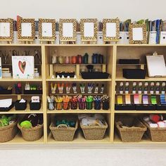 the shelves are filled with art supplies and crafts